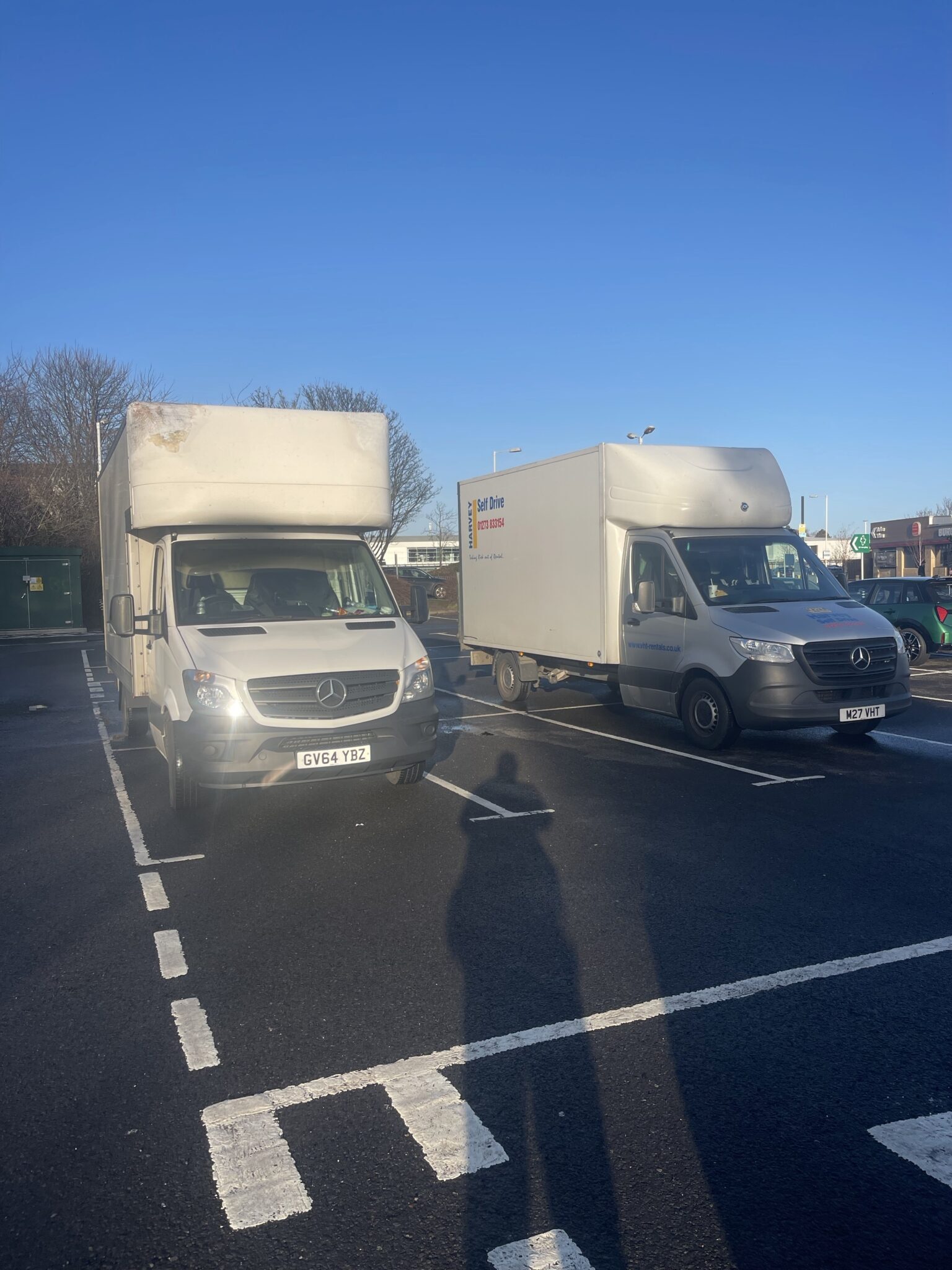 Two Mercedes Luton vans parked side by side in a car park, one ESV Removals van and one Harvey Self Drive rental used for a large Brighton to Edinburgh move.